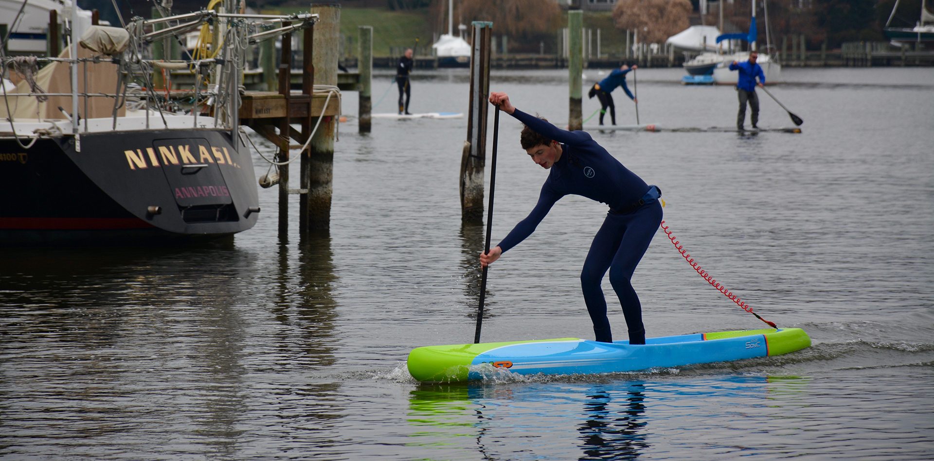 DSC_4065-1920×0-cropped a person riding on the back of a boat in the water