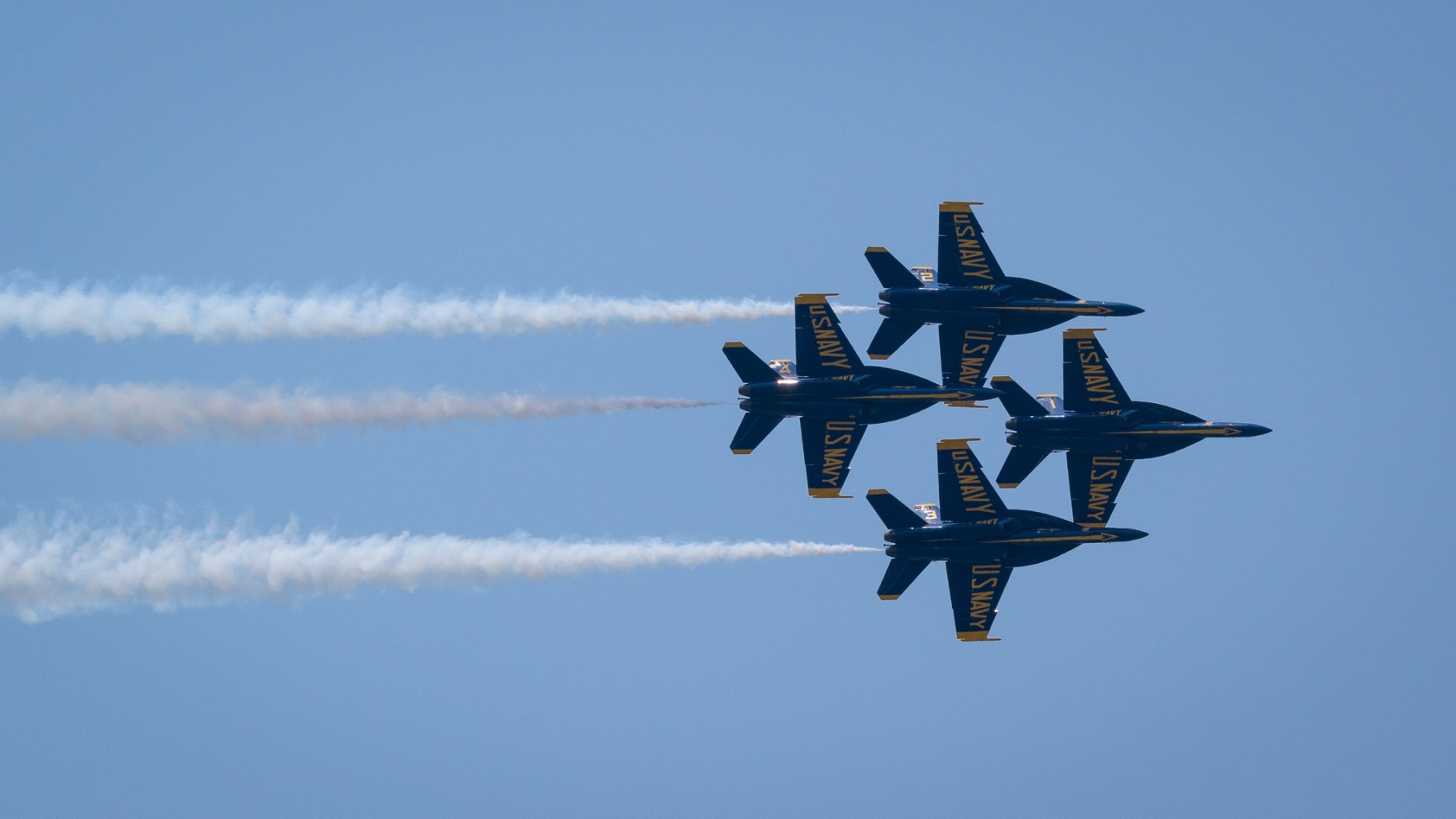 Four United States Navy "Blue Angel" fighter jets in formation