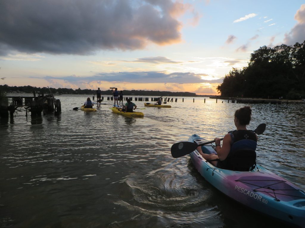 A group of people paddling on the South River