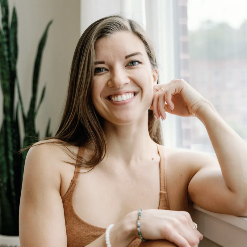 a woman sitting on a table