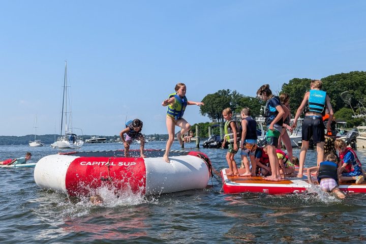a group of people in a boat on a body of water