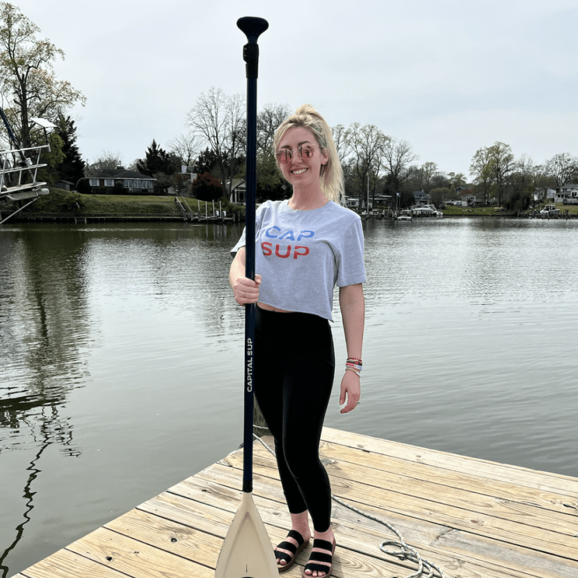 a person standing in front of a body of water