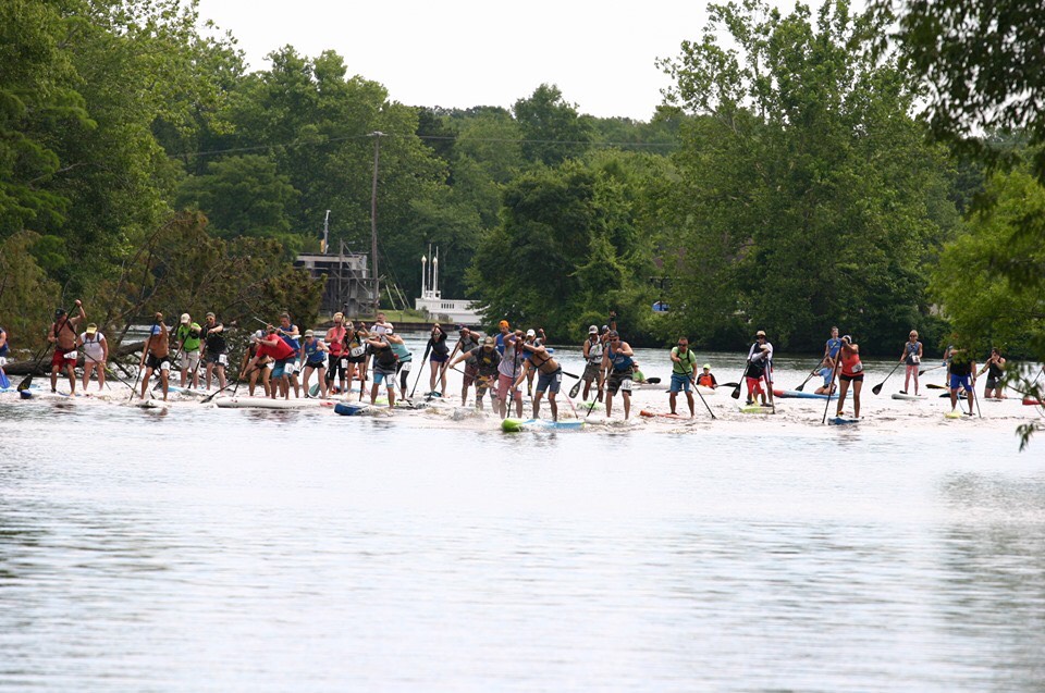 a group of people riding skis on a body of water