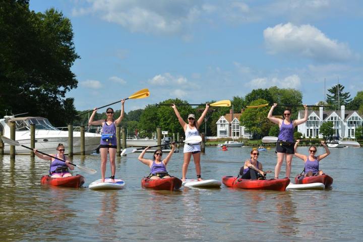 a group of people riding on the back of a boat
