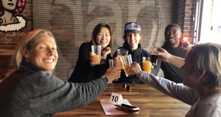 a group of people holding wine glasses