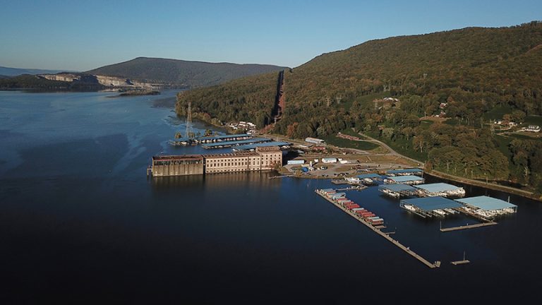 a boat is docked next to a body of water