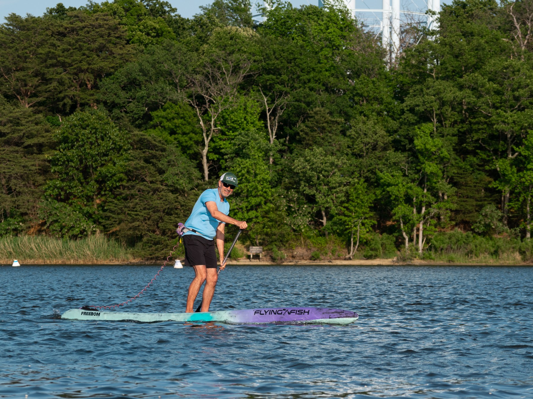 a man water skiing on a lake
