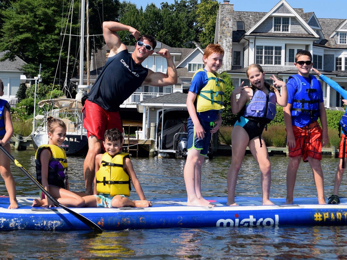 a group of people riding on the back of a boat