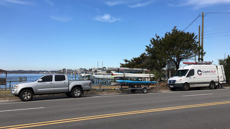 a truck that is driving down the street