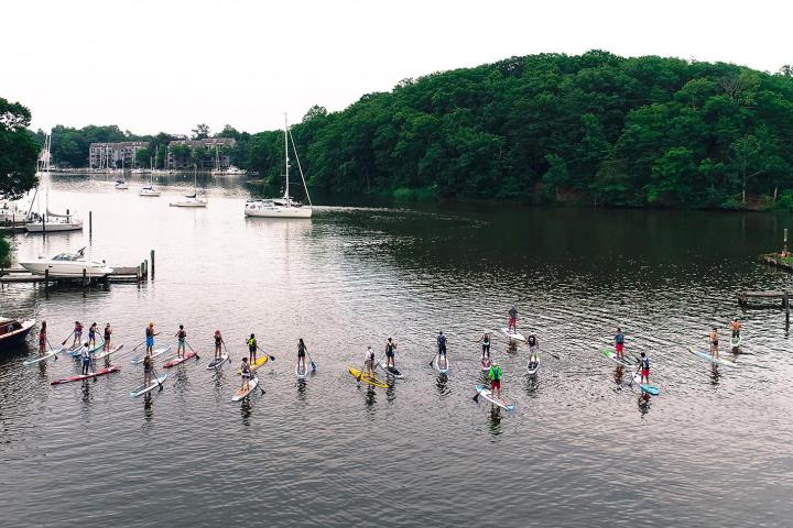 a group of people on a boat in a body of water