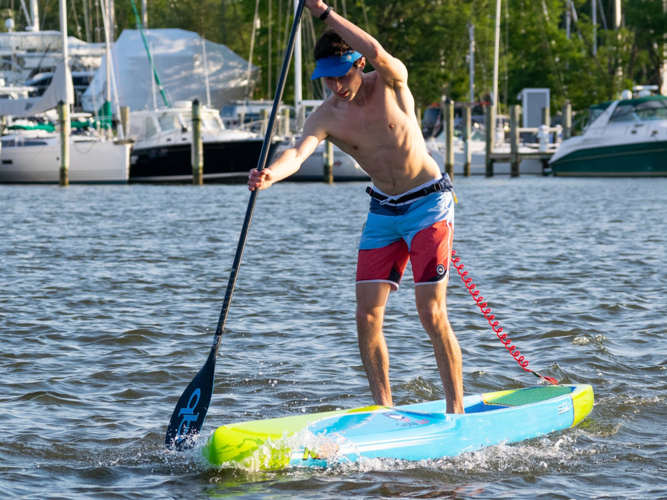 a person riding on the back of a boat in the water