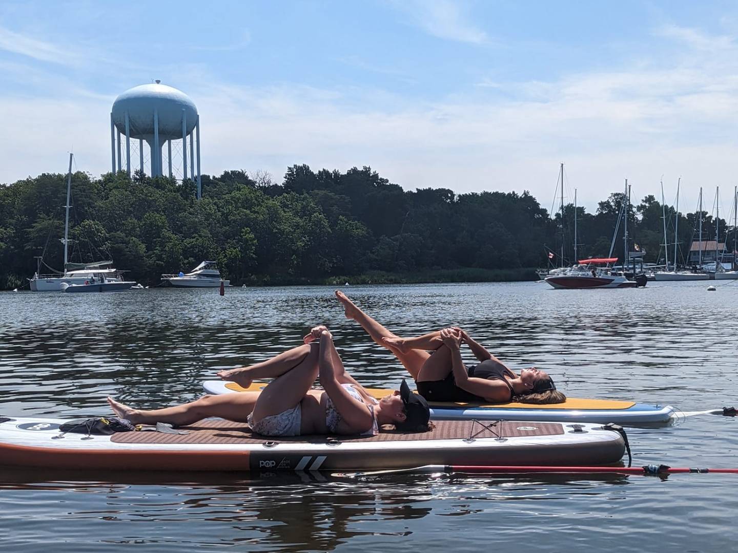 a group of people in a small boat in a body of water