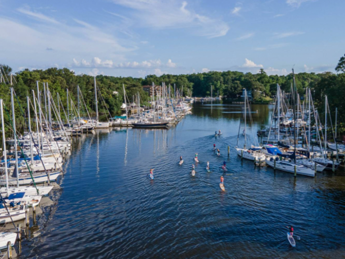 a small boat in a harbor next to a body of water
