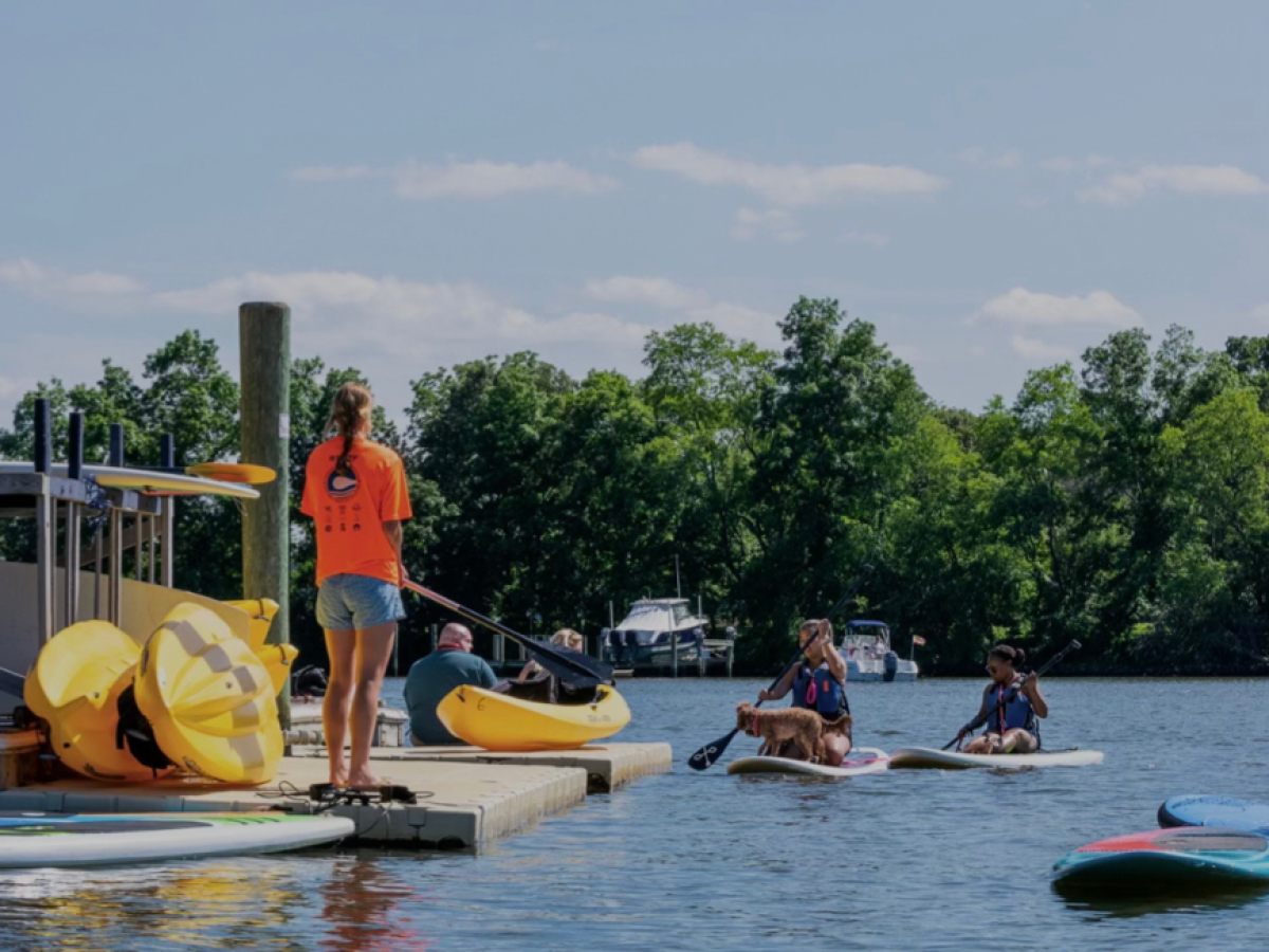 a group of people on a boat in the water