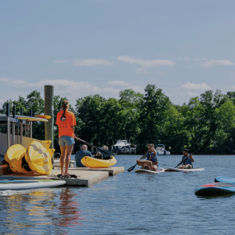 a group of people on a boat in the water