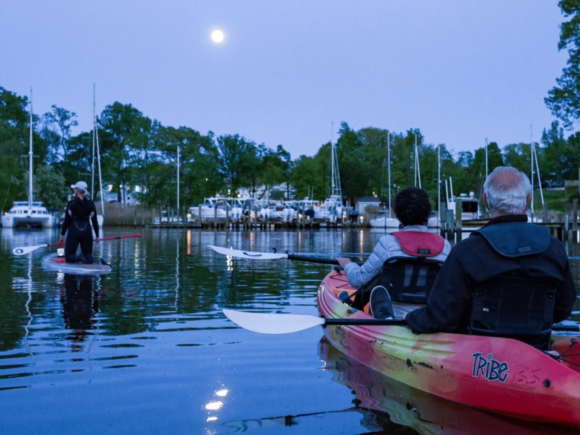 a group of people on a boat in the water