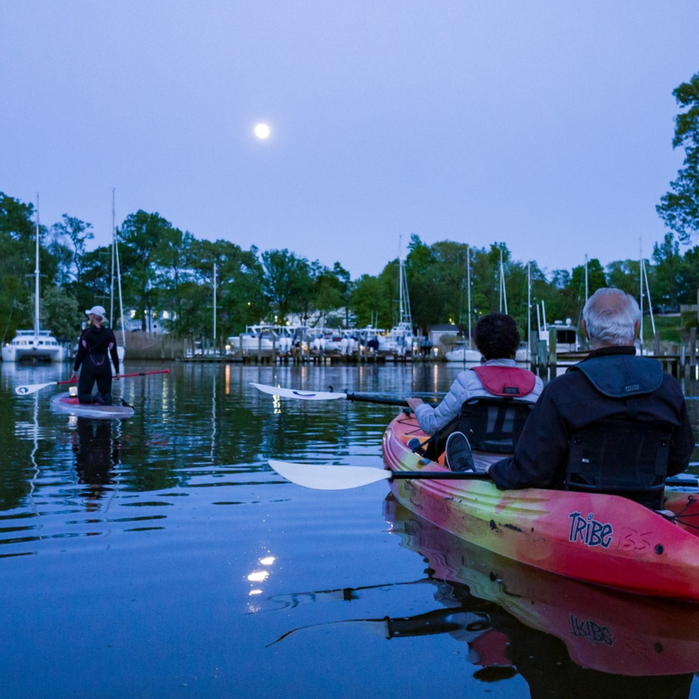 a group of people on a boat in the water