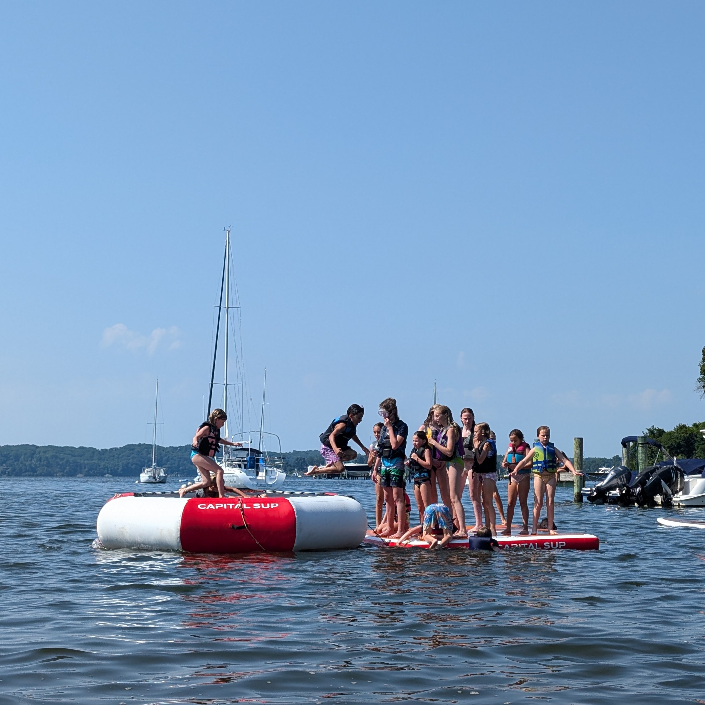 a group of people in a boat on a body of water