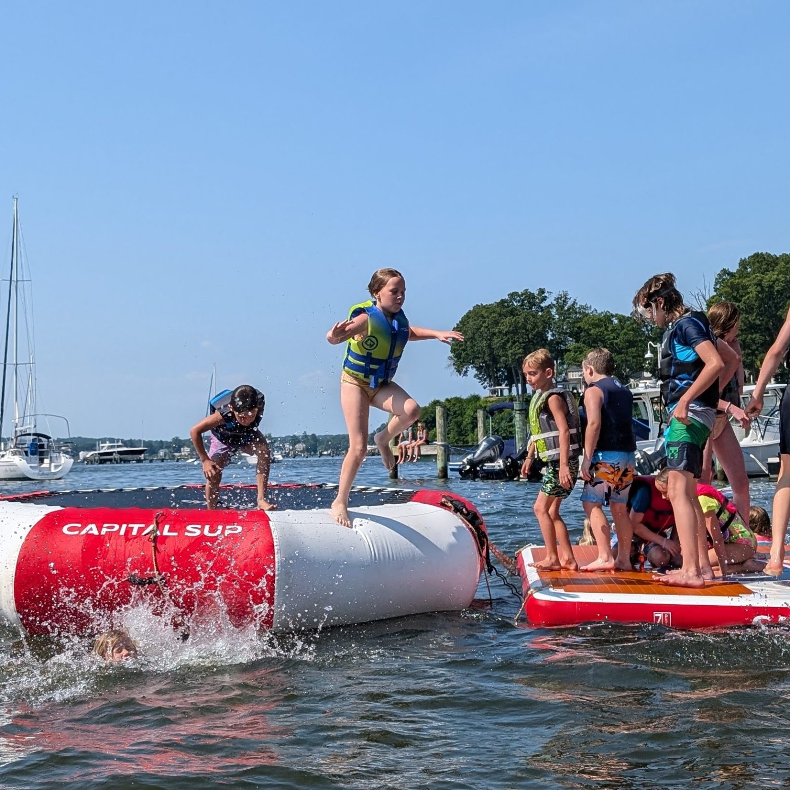 a group of people in a boat on a body of water