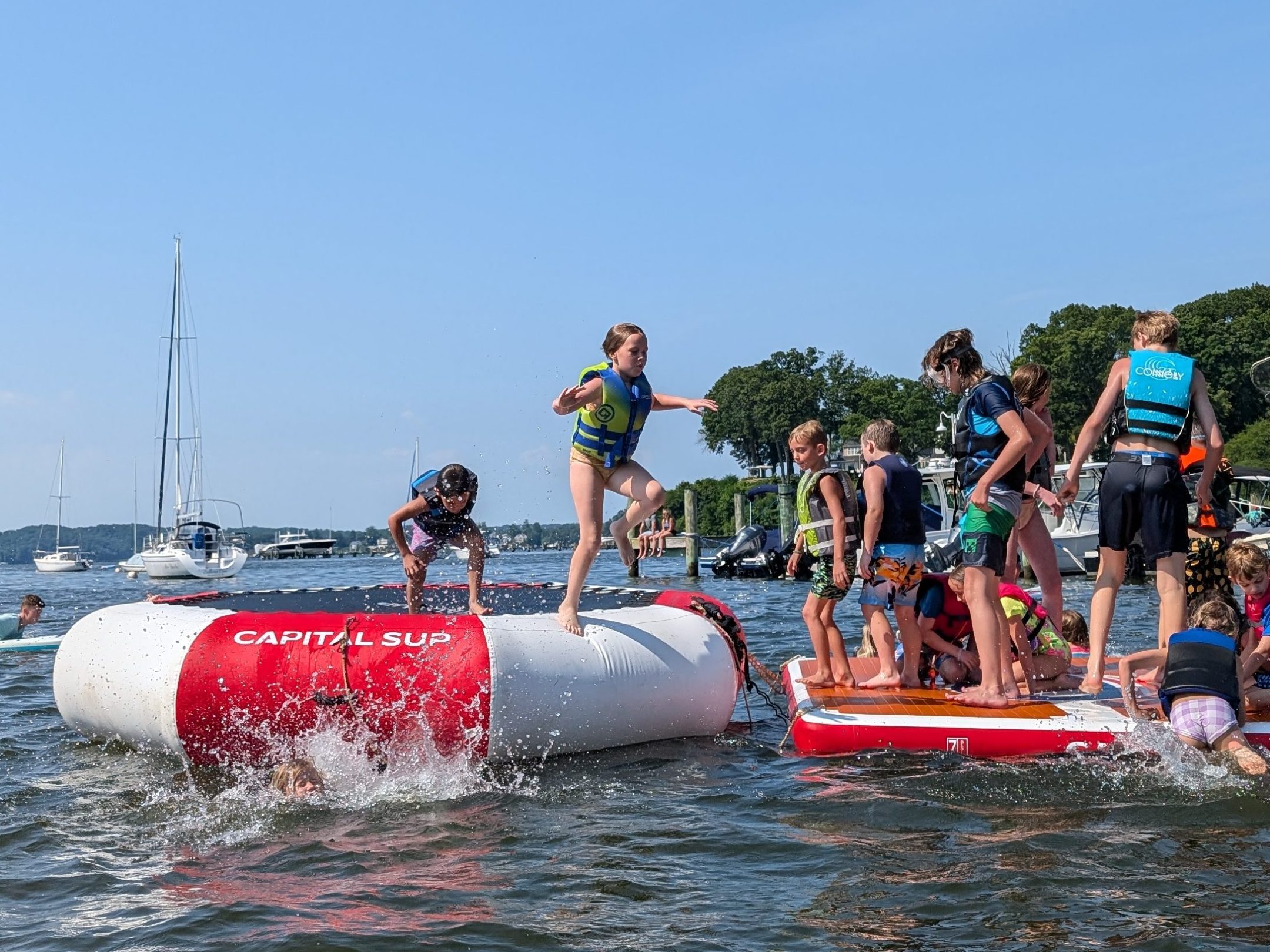 a group of people in a boat on a body of water