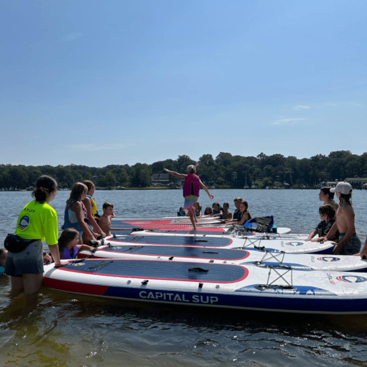 a group of people on a boat in the water