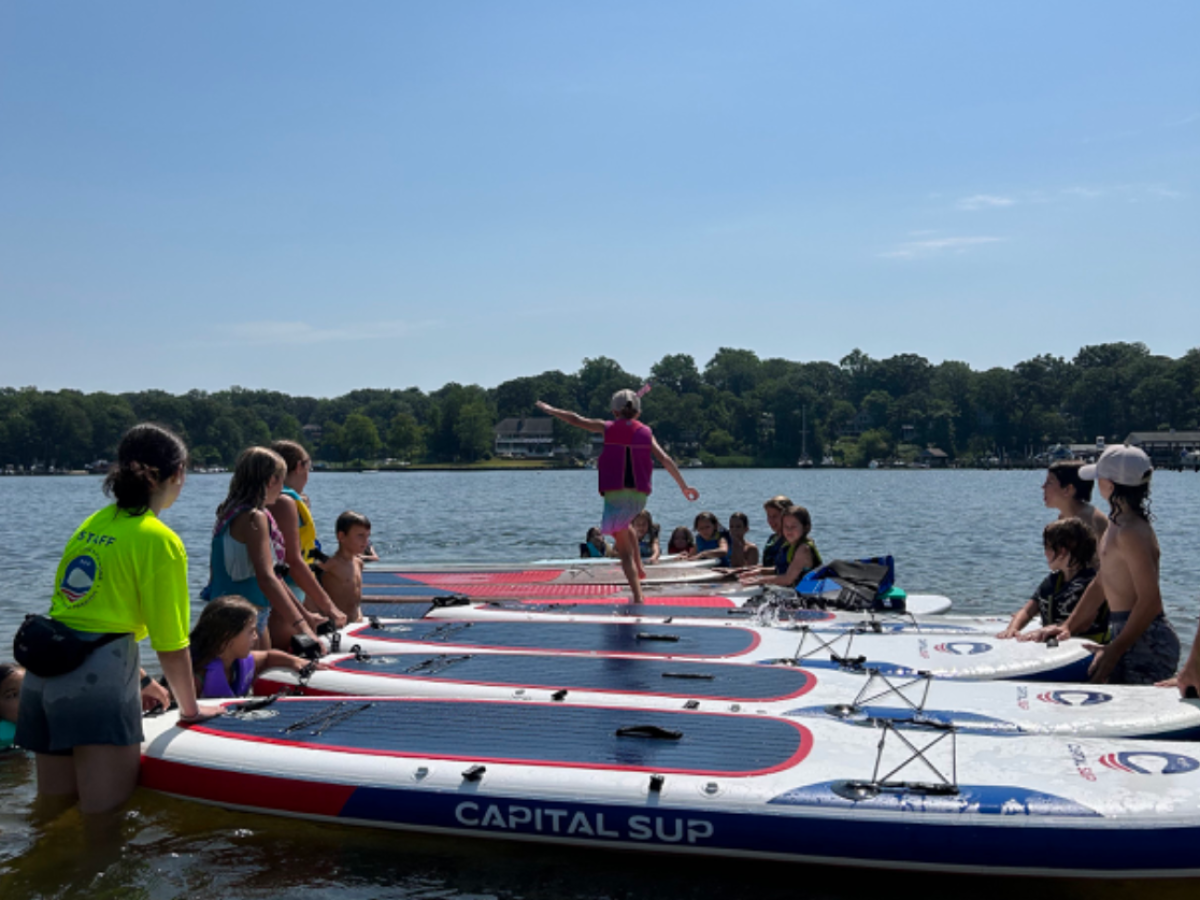 a group of people on a boat in the water
