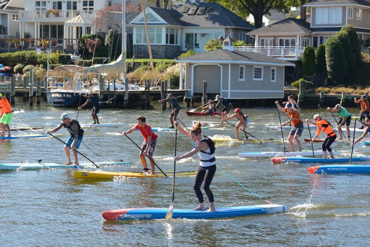 a group of people riding on the back of a boat